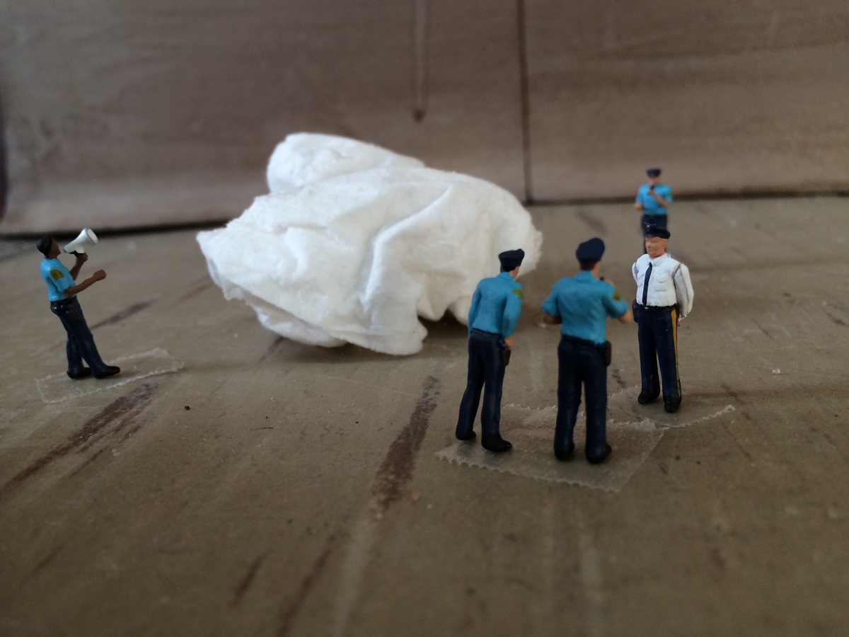 Two police officers talking to a third.